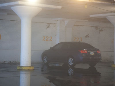 It`s foggy inside my creepy parking garage, and water covers the floor.  There`s no choice but to walk through it.