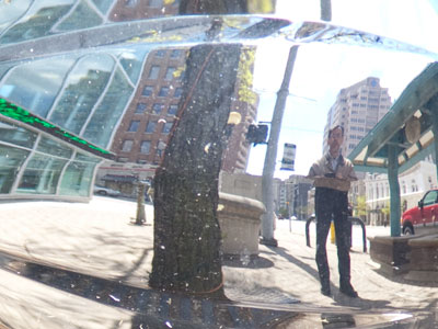 A motorcycle was conveniently parked on the sidewalk.