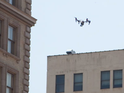 High above the city streets, someone is watching you.