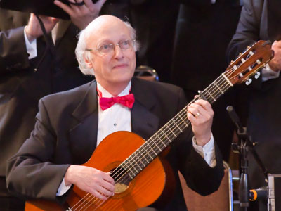 There are two challenges in effect:  capture compelling pictures of a concert, and avoid disturbing the audience.