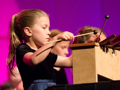 I`m the only person authorized to take photos during the concert, but no doubt moms and dads are snapping away.