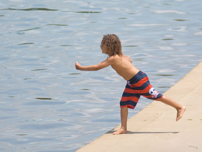 Tormenting ducks: one of the many services boys provide.