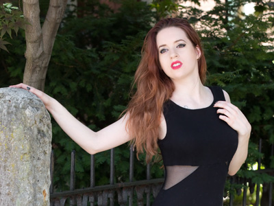 It was so sunny, it was hard for her to keep her eyes open.