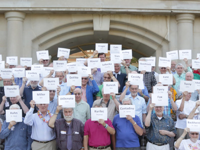 Suddenly a hundred people stood in front of it.