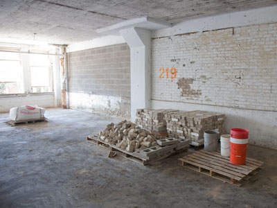 The walls of my creepy parking garage are falling down, so I`m glad to see repairs (although that is my space).