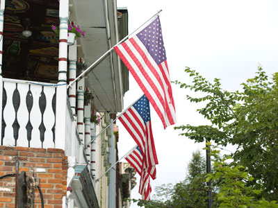 This is America:  flags and surveillance video cameras.
