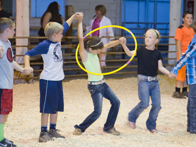 And, in the barn, farm kids play games.  A Saturday night in small town America.