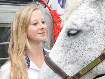 Two blondes at the horse show.