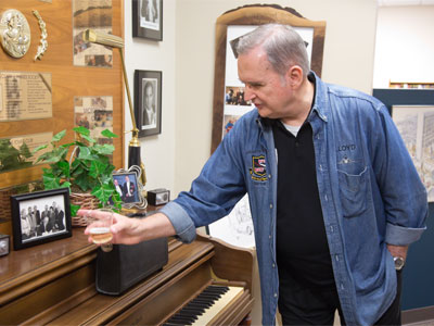 Lloyd looked at a picture of himself and the others who brought the station into existence more than 30 years ago.