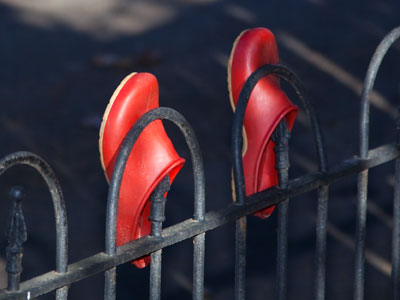 Pairs of shoes appear often in my neighborhood, making me think someone is leaving them as a type of charity.
