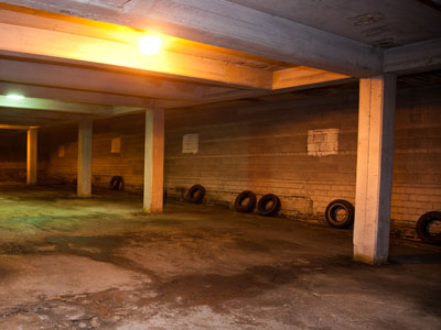 The old tires keep cars from bumping into the wall.
