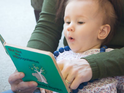 Baby loves books.