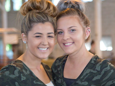 The horses are dirty and the groomers are clean.