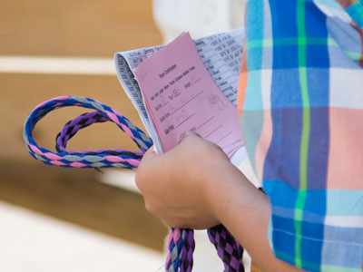 As the animals are put on the truck to be slaughtered, the kids are left with nothing but a receipt and lead rope.