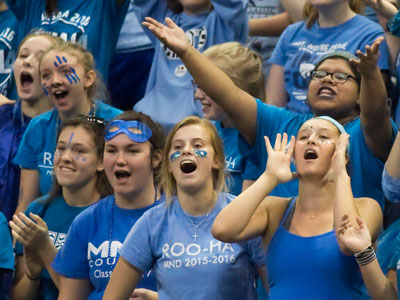 Fans cheered for their team and scorned the other fans.