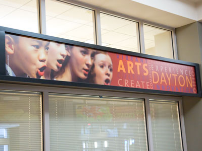 Just beside the first singer`s ear, it says `Photo by Adam Alonzo` (see December 11, 2011).