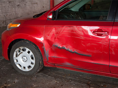 My red car encountered a black car this morning.