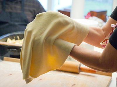 The dough is kneaded, violently thrown and then rolled.