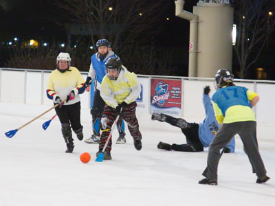 The game is played on ice, but not with ice skates.