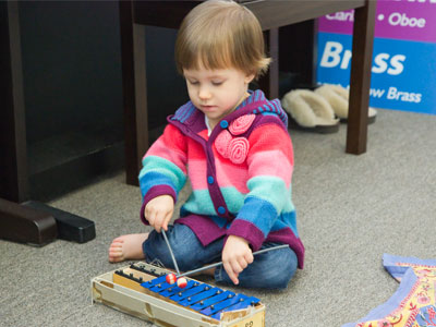 Glockenspiel virtuoso.  She still refuses to wear socks (see December 26, 2016).