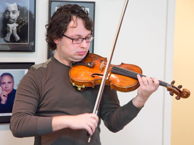Famous violinist Yevgeny Kutik tunes up.