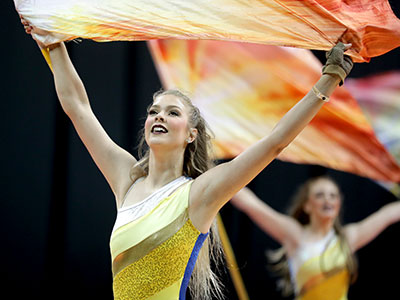 During a color guard competition, a new display of beauty comes out onto the floor every ten minutes.