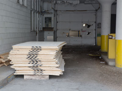 After a fire and many break-ins, it seems someone is getting ready to board up my former parking garage.