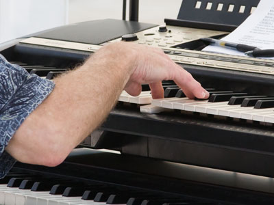He`s playing `While My Guitar Gently Weeps` -- on keyboard.