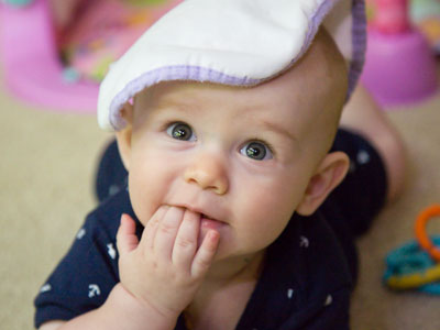 I didn`t put the bib on his head.  That takes a big sister.