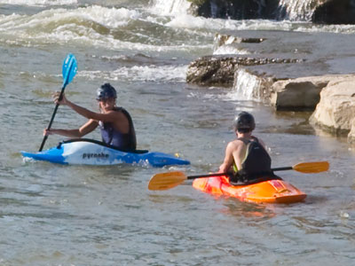 The person in the orange kayak flipped over and spent a terrifyingly long time under water trying to get back up.