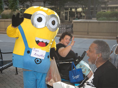 Sure, it`s just another person asking for money on the sidewalk, but at least this one has style.