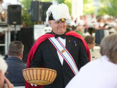 An offering was collected by men who carried swords.