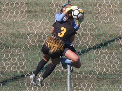 From the opposite end of the field, I could hear a CRACK as their bodies collided in midair.