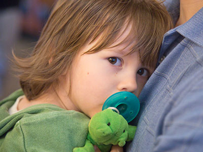 Big sister keeps a watchful eye on little brother.