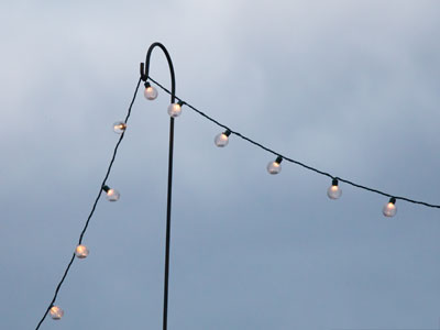 People are eating dinner out on the patio in November.