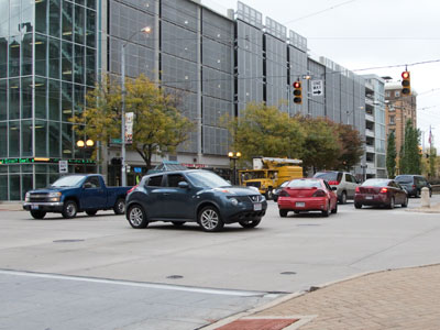 How many violations can you spot in just one picture?  I`m afraid to cross this street every evening after work.