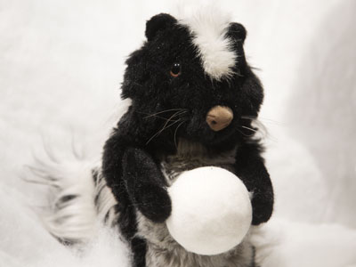 It`s a skunk with a snowball, of course.