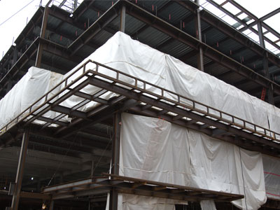 The sheets are an attempt to keep the workers warm.