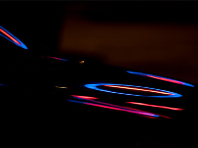 Somebody`s shiny car in the parking lot.