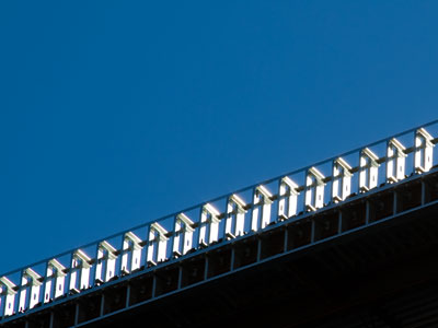 There are probably birds living inside this unfinished building, thinking they`ve found a good place to nest.
