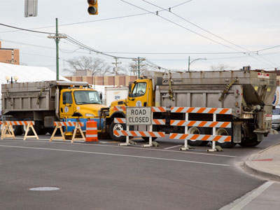 Celebrations today occur in the shadow of violence.  These trucks are blocking the road to prevent an attack.