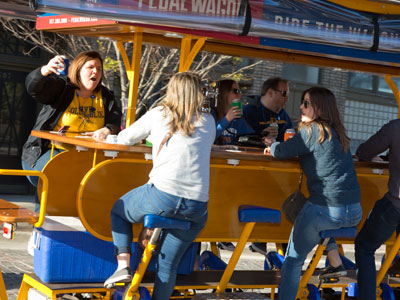 They pedaled slowly past, singing `Country Roads Take Me Home,` annoying the drivers behind them.