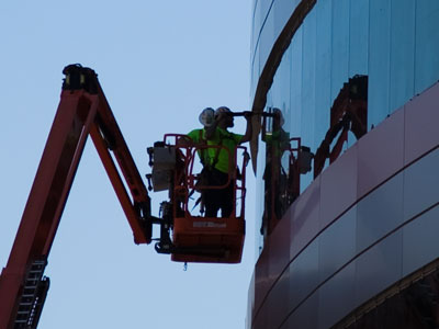 Builders building a building.