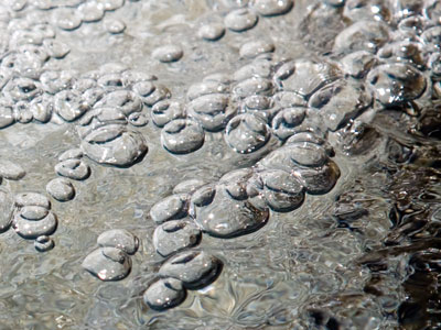 I took harmless photos of bubbles while being watched closely by a suspicious person.