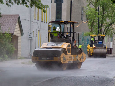 Street paving took longer than expected, but resulted in this ghostly photo.  I had to walk across that hot asphalt.