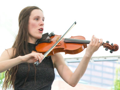 She was singing about Indiana cornfields, so I don`t think she`s from Ireland.  And that IS NOT a fiddle.
