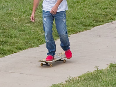 Nearby there`s a sign that says NO SKATEBOARDING.