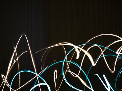 There are people jumping around with flashlights.