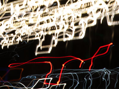 Traditional incandescent lights leave solid color streaks, but newer LED lights break apart into little dashes.