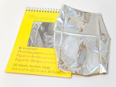 Cut a piece of mylar so it`s about the same size as the paper.  Precision is unnecessary.